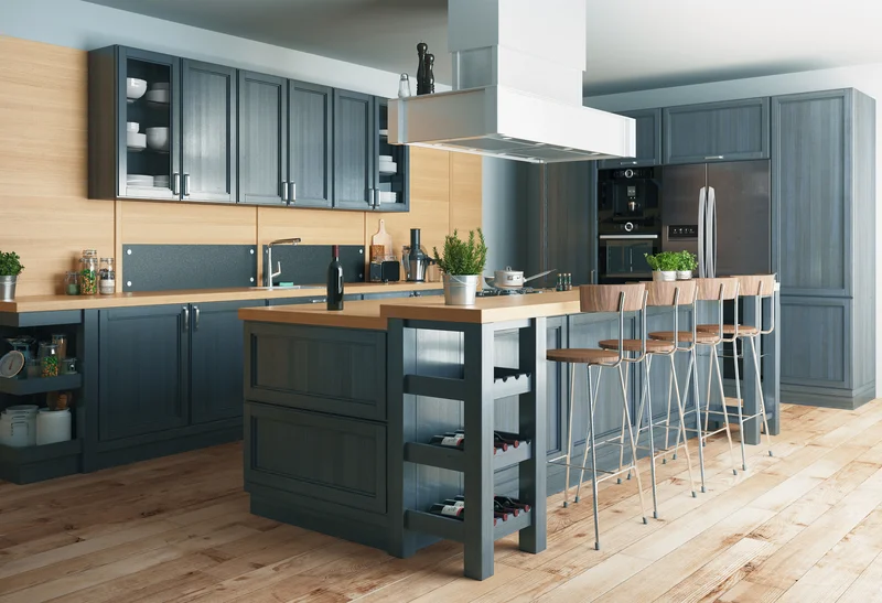 Modern kitchen with deep blue cabinets and light wood countertops.